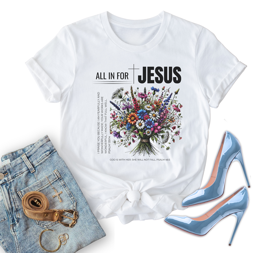 unisex all in for jesus christian t shirt, paired with jeans, gold accessories, and pale blue shiny stiletto heels.