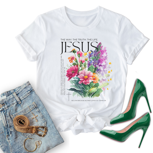White christian t-shirts with floral design, paired with jeans and high heels on a white background
