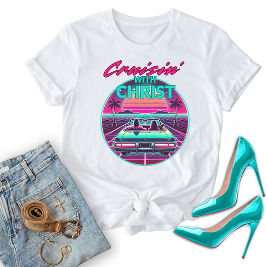 White Christian t-shirt with 'Cruisin' with Christ' design, paired with jeans and high heels on a white background