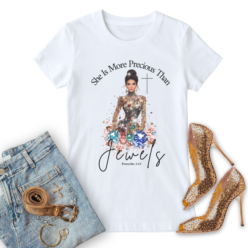 white christian t-shirt, she is more precious than jewels, with a graphic design featuring a woman, text, and accessories on a white background.